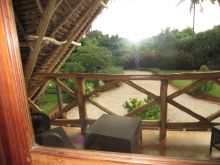 The garden veranda overlooks the lush foliage and manicured lawns at Villa Turquoise, Zanzibar, Tanzania (Mango staff photo)