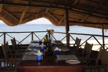 Beach side dining at Kungwe Beach Lodge, Mahale Mountains National Park, Tanzania