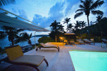 Sun loungers by the pool at New Emerald Cove, Praslin, Seychelles
