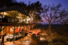 Veranda and exterior of lodge at Xudum Okavango Delta Lodge, Okavango Delta, Botswana (AndBeyond)