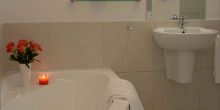 The bathrooms with soaking tub at Bosavern Guesthouse, Plettenberg, South Africa