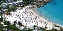 Turquoise waters lap onto the white sand beaches, perfect for swimming and sunbathing at Camps Bay Beach, Cape Town, South Africa