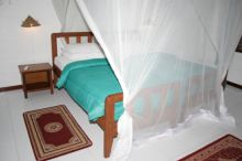 Flame Tree Cottages - Jasmine Cottage Bedroom