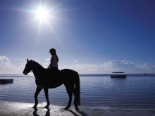 Horseback riding on the beach at Four Seasons Mauritius, Anahita, Mauritius