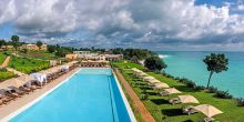 Lounge in the sun by the beautiful pool at Hideaway of Nungwi Resort & Spa, Zanzibar, Tanzania