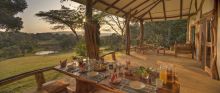 Watch the sunset over the water hole from the spacious front veranda at Mara House, Masai Mara National Reserve, Kenya (photo by Stevie Mann)