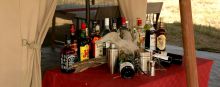Enjoy a cocktail while gazing at the savannah at Serengeti Savannah Camps, Serengeti National Park, Tanzania