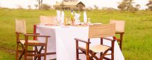 Dine al fresco with the sounds of the savannah around you at Serengeti Savannah Camps, Serengeti National Park, Tanzania