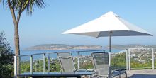 The sun deck with stunning vistas of the valley below at Bosavern Guesthouse, Plettenberg, South Africa
