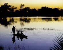 Boating on the delta at sunset at Xigera Camp, Moremi Game Reserve, Botswana (Dana Allen)